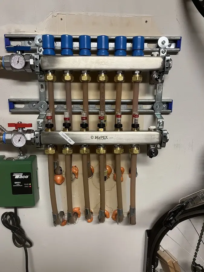 Plumber performing Water Heater Repair at a residential property in Ionia